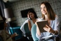 Young professional businesswoman sitting at table at cafe Royalty Free Stock Photo