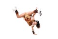 Young professional cheerleader dressed in a warrior costume standing on one hand. Horizontal splits