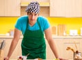 Young professional cook preparing in kitchen Royalty Free Stock Photo