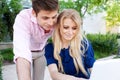 Young professional couple on laptop