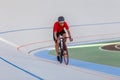 Young professional cyclist on a velodrome