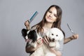 Young professional groomer with pets