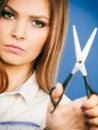 Young professional hairdresser with scissors.