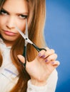 Young professional hairdresser with scissors.