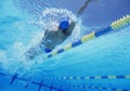 Young professional male athlete doing backstroke in swimming pool Royalty Free Stock Photo