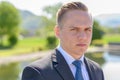 Young professional man standing thinking deeply Royalty Free Stock Photo