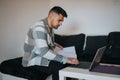 Young professional man working remotely from a modern home setup Royalty Free Stock Photo
