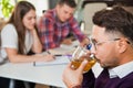 Young professional man drink tea have a break at business brainstorming Royalty Free Stock Photo