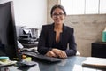 Young professional mixed race woman sitting in an office Royalty Free Stock Photo