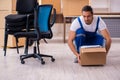 Young male professional mover doing home relocation