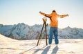 Young professional skier at sunset on relax moment in french alps