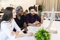 Young international professional team discussing business plan in the office Royalty Free Stock Photo