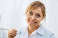 Young Woman Dentist with Dental Drill