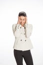 Young professional woman dressed for business with a large smile looking stressed out. Great concept for pressure, headache. Royalty Free Stock Photo