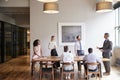 Young professionals around a table at a business meeting Royalty Free Stock Photo