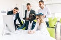 Young professionals team work in modern office. Project manager team discussing new idea. Business crew working with startup. Royalty Free Stock Photo