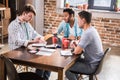 Young professionals working on business project together Royalty Free Stock Photo