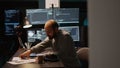 Young programmer typing server code on multiple monitors Royalty Free Stock Photo