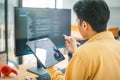 Young programmer working on coding, software development and web design in software company office.Concept technology development Royalty Free Stock Photo