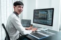 Young Programmer working in software javascript computer in IT office, Writing codes and data code website and coding database Royalty Free Stock Photo