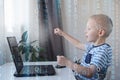 Young programmer writing code on a computer at home. Programming lessons, scratch for kids. Royalty Free Stock Photo