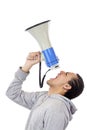 Young protester shouts angrily in megaphone Royalty Free Stock Photo