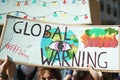 Young protesters holding placards during the climate strike march