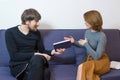 Young psychotherapist works with a patient in the office. Psychology, psychotherapy, mental health, concept of help and support Royalty Free Stock Photo