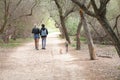 Young punk couple walking their dogs in a park Royalty Free Stock Photo