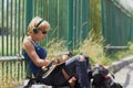 Young punk girl skater in headphones Royalty Free Stock Photo