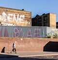 Young punk rock guy walking in Shoreditch.