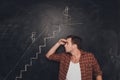 Young purposeful man looking at drawn career stairs Royalty Free Stock Photo