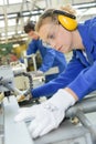 Young qualified people forced to work at factory