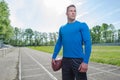 Young quarterback with the ball at the stadium