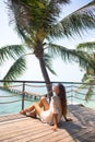 The young quite stylish sensual woman posing on the amazing tropical beach with the blue ocean enjoy her holiday and a windy summe Royalty Free Stock Photo