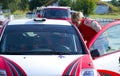 Young rallye driver is checking his car