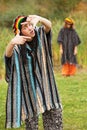 Young rastafarian people in autumn park