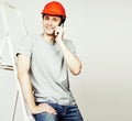 young real hard worker man isolated on white background on ladde Royalty Free Stock Photo