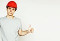 Young real hard worker man on white background on ladde