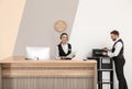 Young receptionists in professional uniform Royalty Free Stock Photo