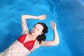 Young Red Bikini Female In Swimming in Pool Royalty Free Stock Photo