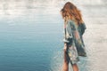 Young red hair woman walking at river alone Royalty Free Stock Photo