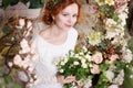 Young red-haired bride in a green wreath Royalty Free Stock Photo