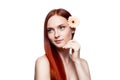 Young red-haired female with flower in hair Royalty Free Stock Photo