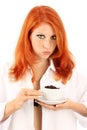 Young red-haired girl and coffee Royalty Free Stock Photo