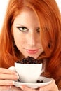 Young red-haired girl and coffee Royalty Free Stock Photo