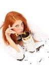 Young red-haired girl and coffee grinder Royalty Free Stock Photo