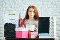 Young red-haired girl has forgotton to buy a present Royalty Free Stock Photo