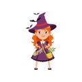 Young red-haired girl witch standing with arms akimbo. Kid character in costume, bag with herbs and belt with potions Royalty Free Stock Photo