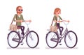 Young red-haired man and woman riding a bicycle Royalty Free Stock Photo